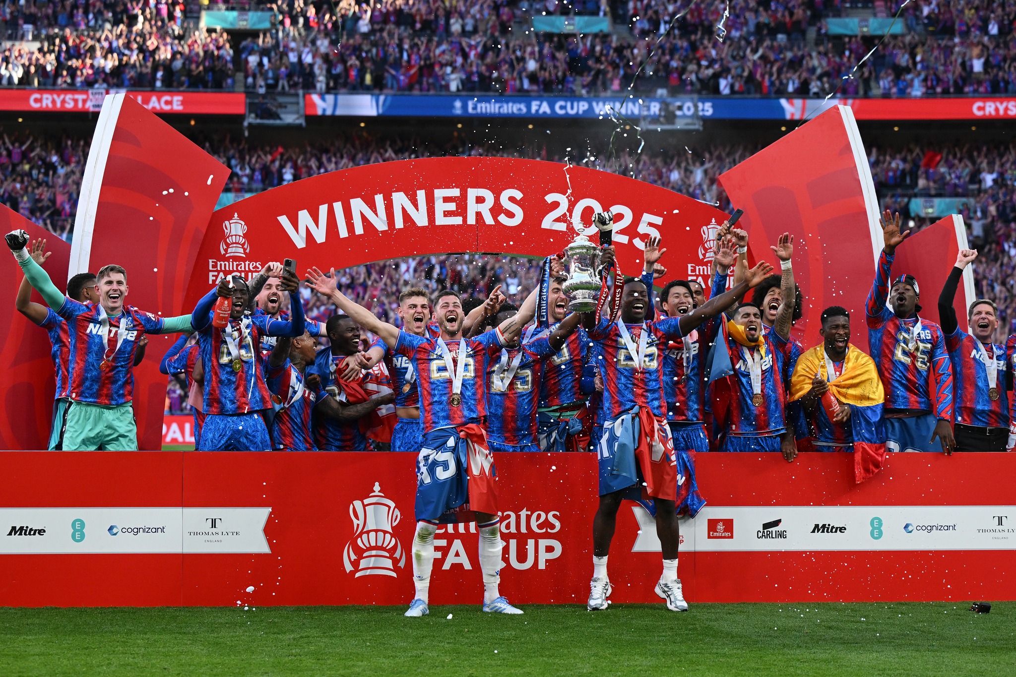 LONDON, ENGLAND - MAY 17: Marc Guehi and Joel Ward of Crystal Palace lift the FA Cup trophy after their team&#039;s victory in the Emirates FA Cup Final match between Crystal Palace and Manchester City at Wembley Stadium on May 17, 2025 in London, England. (Photo by Shaun Botterill/Getty Images)