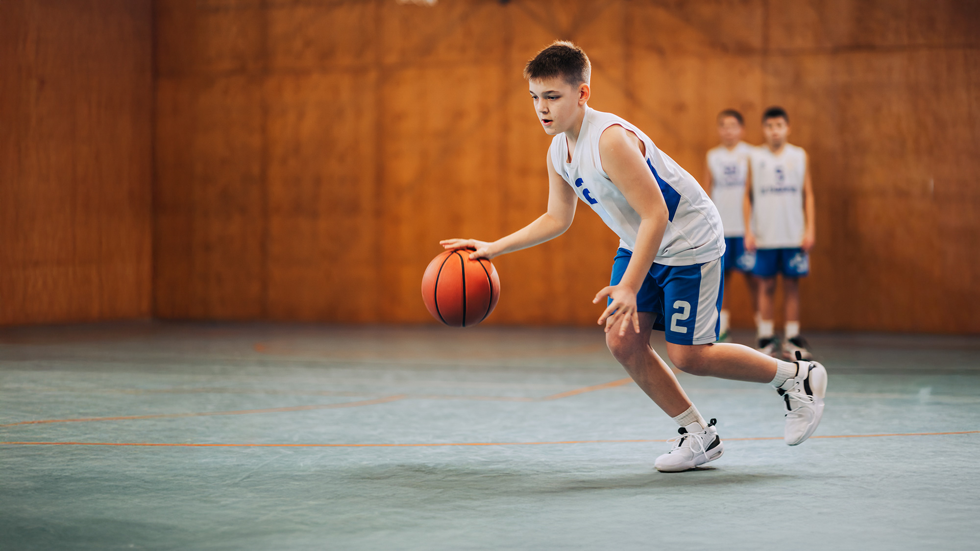 red and white prohibitory tape on the fence of the sports complex. Closed for visiting, quarantine