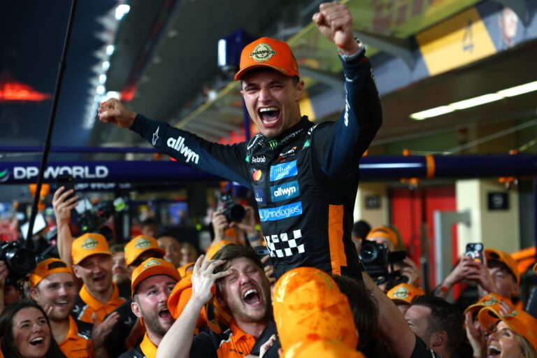 ABU DHABI, UNITED ARAB EMIRATES - DECEMBER 07: 2025 F1 World Drivers Champion Lando Norris of Great Britain and McLaren celebrates with his team during the F1 Grand Prix of Abu Dhabi at Yas Marina Circuit on December 07, 2025 in Abu Dhabi, United Arab Emirates. (Photo by Zak Mauger/LAT Images)